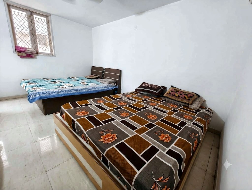 Four sharing room with double beds for boys at Shivam PG Bopal, Ahmedabad