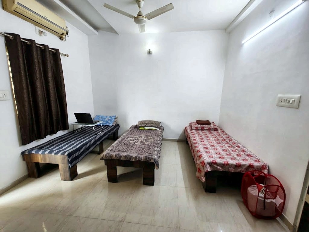 Triple sharing AC room for boys at Shivam PG Bopal, Ahmedabad